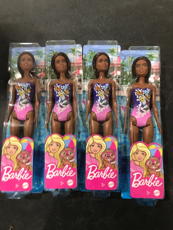 Photo 1 of A box lot of miscellanous Barbie dolls. Contains four 