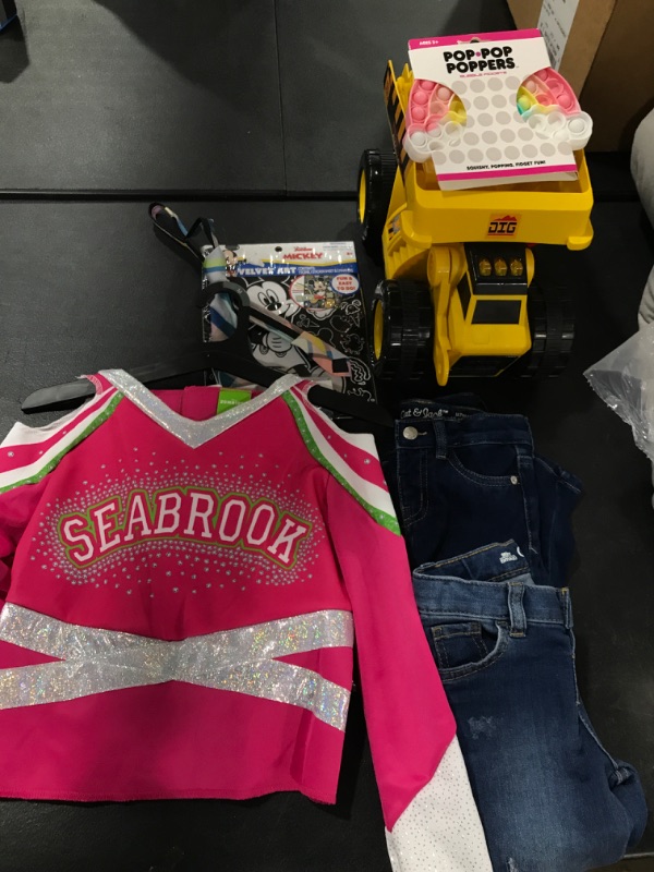 Photo 1 of A box lot of children's toys and clothes', includes a cheer costume SIZE:MEDIUM 