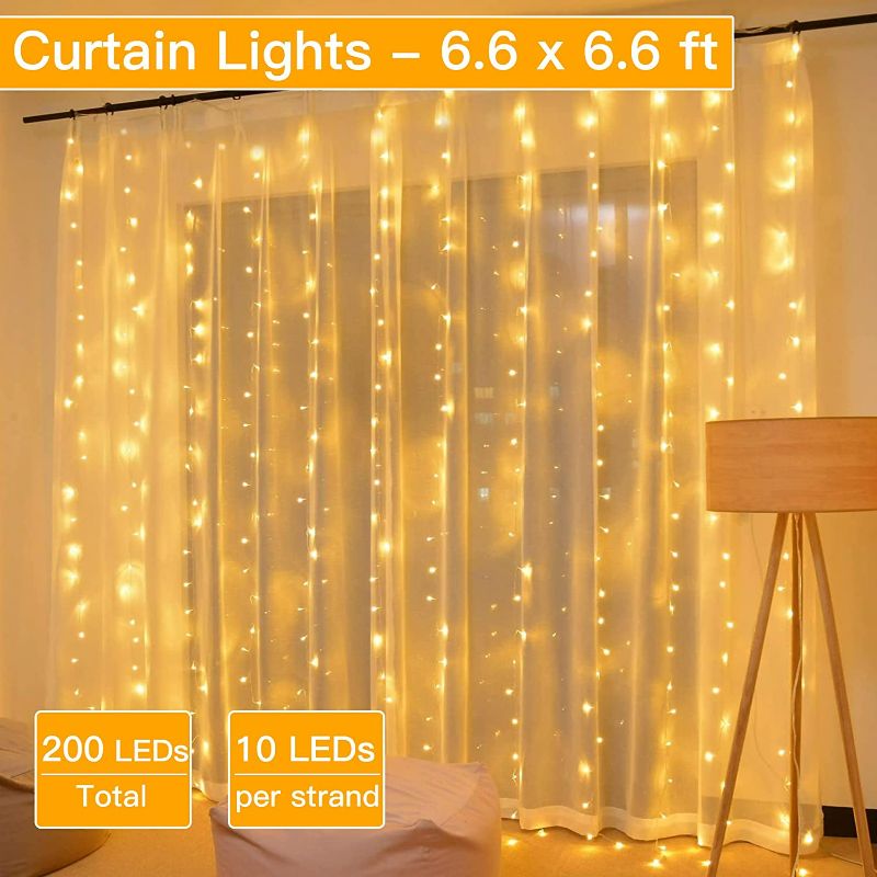 Photo 2 of Ollny Fairy Lights, 200 LED 6.6x6.6ft Curtain Lights with 8 Modes Timer & Remote, USB Powered Waterproof String Lights for Bedroom Party Wall Home Wedding Decorations(Warm White)