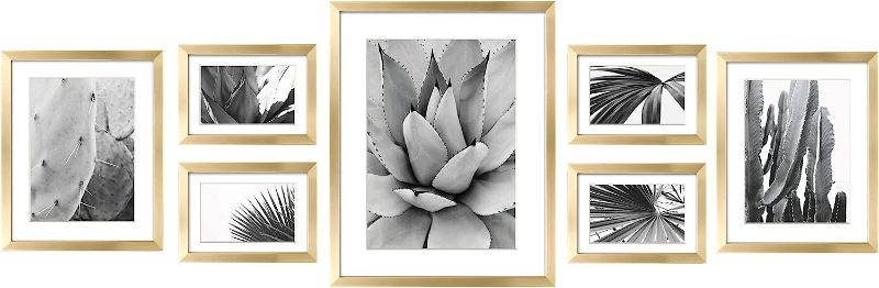 Photo 1 of ArtbyHannah 7 Pack Gold Gallery Wall Picture Frames Sets with Decorative Botanical Art Prints for Photo Frame Collages for Home Decoration, Multiple Sizes 11x14x1, 8x10x2, 5x7x4
