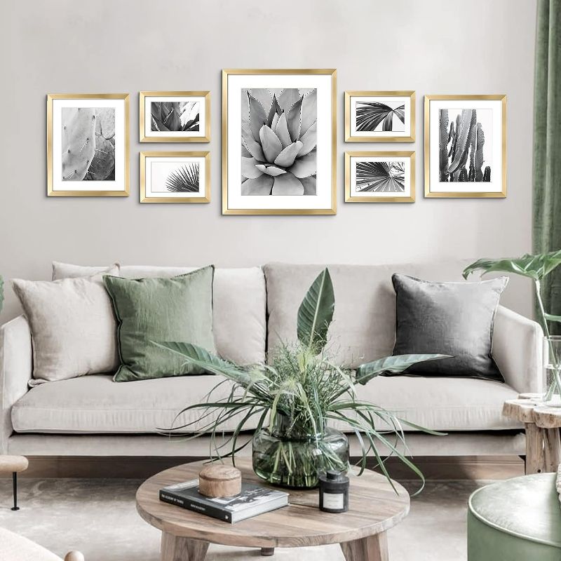 Photo 2 of ArtbyHannah 7 Pack Gold Gallery Wall Picture Frames Sets with Decorative Botanical Art Prints for Photo Frame Collages for Home Decoration, Multiple Sizes 11x14x1, 8x10x2, 5x7x4
