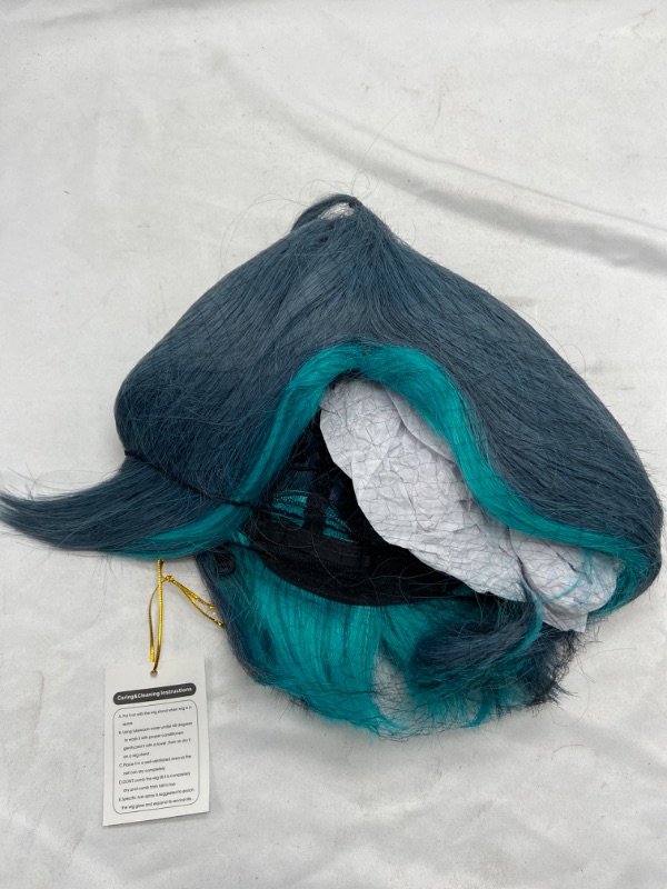 Photo 2 of ydound Short Bluish Green Blue Wig for Xiao Genshin Impact Game Anime Fluffy Cosplay Hair Wigs with Bangs + Cap Coser Wig
