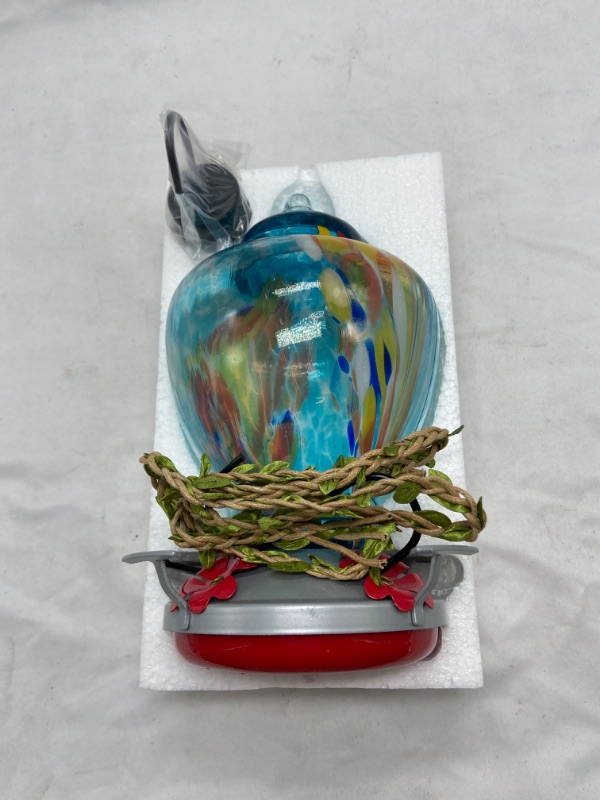 Photo 4 of WOSIBO Hummingbird Feeder for Outdoors Patio Large 32 Ounces Colorful Hand Blown Glass Hummingbird Feeder with Ant Moat Hanging Hook, Rope, Brush and Service Card (Blue-Firework)
