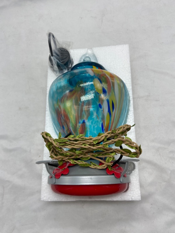 Photo 1 of WOSIBO Hummingbird Feeder for Outdoors Patio Large 32 Ounces Colorful Hand Blown Glass Hummingbird Feeder with Ant Moat Hanging Hook, Rope, Brush and Service Card (Blue-Firework)
