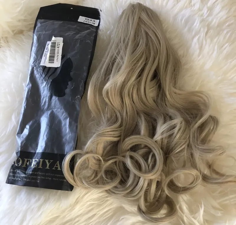 Photo 2 of SOFEIYAN Ponytail Extension 22" Claw Clip Ponytail Hair Extensions Long Curly Wavy Ponytail Fluffy Clip on Pony Tails Synthetic Hairpiece for Women?Light Blonde mix Bleach Blonde Evenly Q43 24/613#