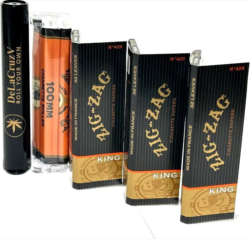 Photo 1 of Zig Zag King Size Cigarette Rolling Paper (3 Packs) +Zig Zag Roller 100MM with DeLaCruzV tube.
