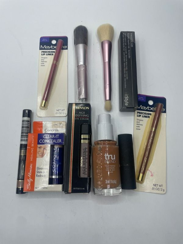 Photo 1 of Miscellaneous variety makeup brand Name cosmetics including ( Maybelline ,True Blend, Revlon ,It Style, Sally Hansen & DISCONTINUED MAKEUP ITEMS)