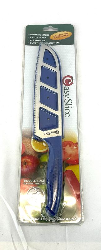 Photo 2 of EASY SLICE KNIFE DOUBLE SCALLOPED SERRATION CUTS STRAIGHT EVEN IF YOUR LEFT-HANDED NO SLIP GRIP HANDLE AND NO STICK BLADE COLOR BLUE SIZE 8 IN NEW IN PACKAGE
