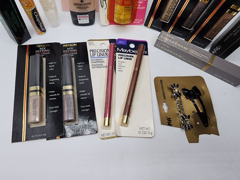 Photo 2 of Miscellaneous Variety Brand Name Cosmetics Including (( Revlon, Elf, Blossom, Sally Hansen, Loreal, Itstyle, Vincent Longo, Mally, Maybelline, Chapstick)) Including Discontinued Makeup Products 