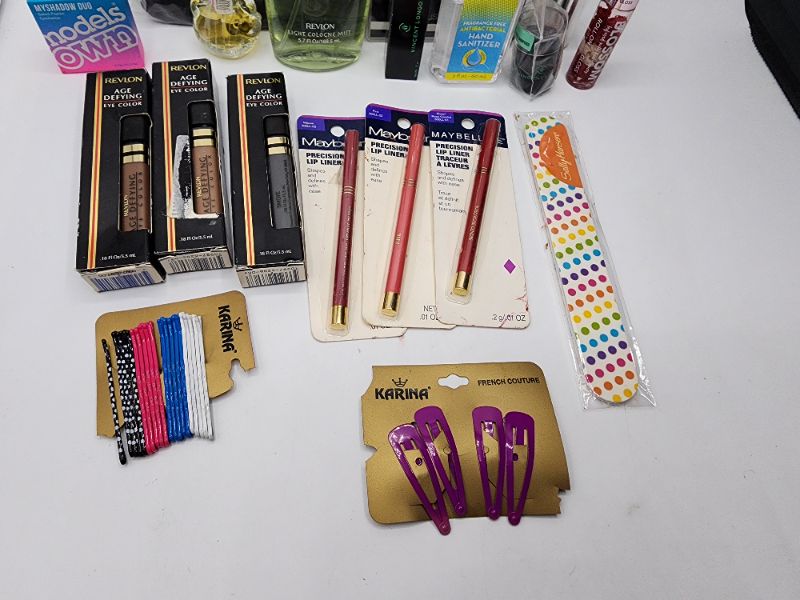 Photo 2 of Miscellaneous Variety Brand Name Cosmetics Including (( Adrift, Elf, Revlon, Models Own, Hello Kitty, Sally Hansen, Maybelline, Blossom, Vincent Longo))  Including Discontinued Makeup Products