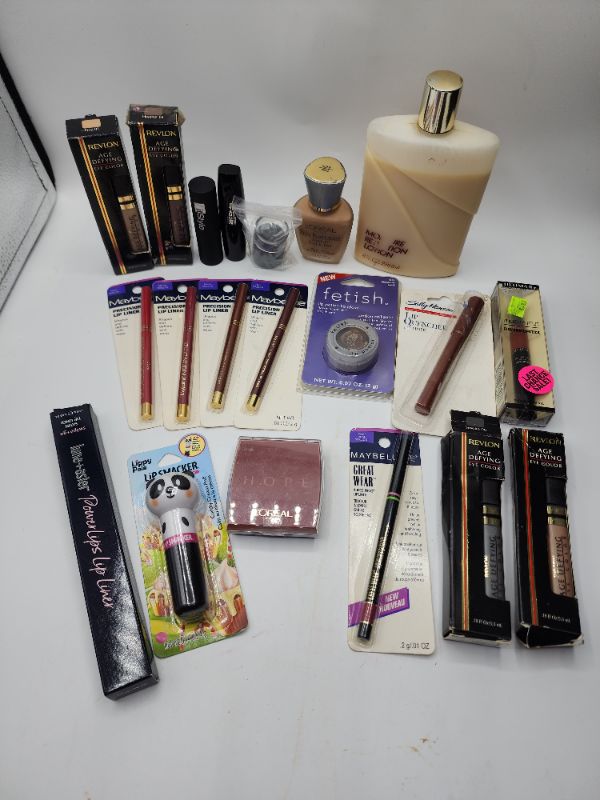 Photo 1 of Miscellaneous Variety Brand Name Cosmetics Including (( Maybelline, Revlon, Lip Smackers, Loreal, ItStyle, Ultima II, Vincent Longo Sally Hansen )) Including Discontinued Makeup Products