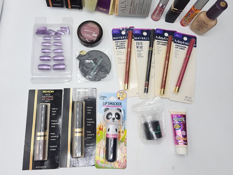 Photo 1 of Miscellaneous Variety Brand Name Cosmetics Including (( Maybelline, Revlon, Pro 10, Loreal, Almay, Vincent Longo, Bubble Yum, Lip Smackers)) Including Discontinued Makeup Products