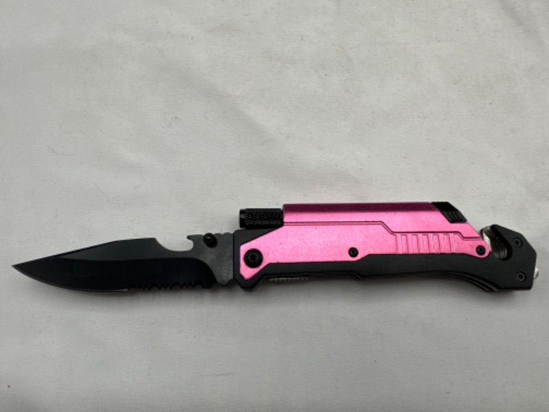 Photo 1 of Pink Pocket Knife With Flashlight Seat Belt Cutter Knife Sharpener Stone and Window Breaker New