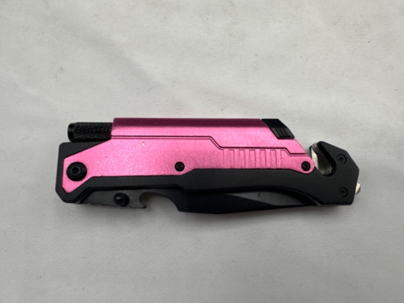 Photo 2 of Pink Pocket Knife With Flashlight Seat Belt Cutter Knife Sharpener Stone and Window Breaker New