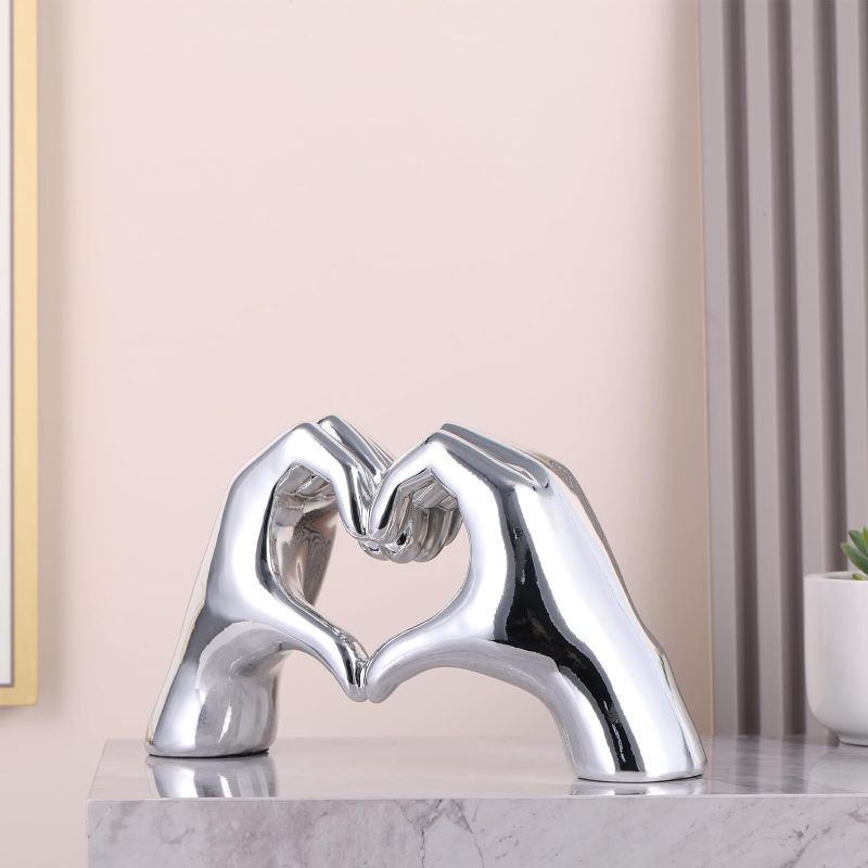 Photo 3 of Silver heart sculptures and statues, silver home decor, hand heart sculpture home decor, modern art home decor accents, romantic wedding decor, office coffee table desk entryway entryway tabletop deco
