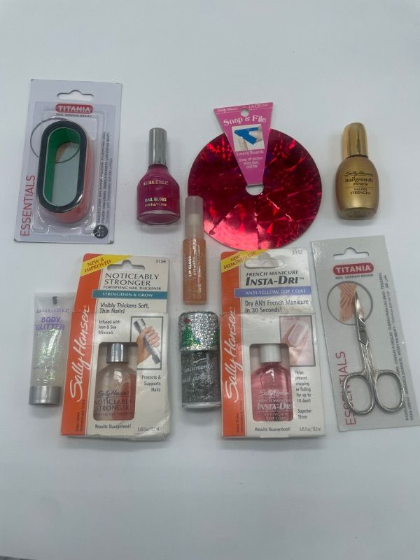 Photo 2 of Miscellaneous Variety Brand nail products nail clippers, nail polish , hard top coat , nail file .