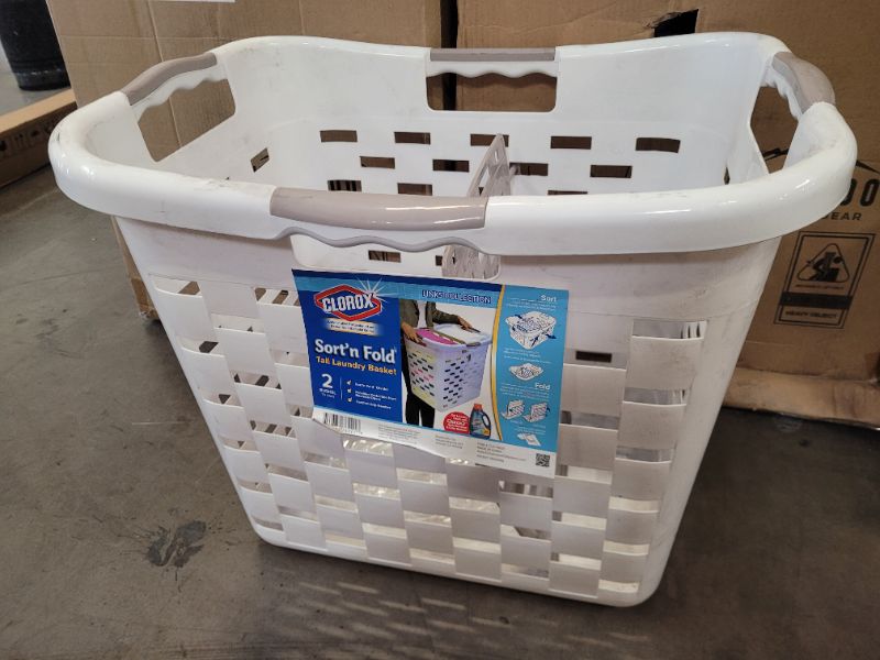 Photo 1 of Clorox Plastic Laundry Baskets with Divider, | 2-in-1 Sorter and Clothing Folding Board | Antimicrobial Protection & Comfort Grip Handles | 2-Bushel Hamper Storage, Tall, White