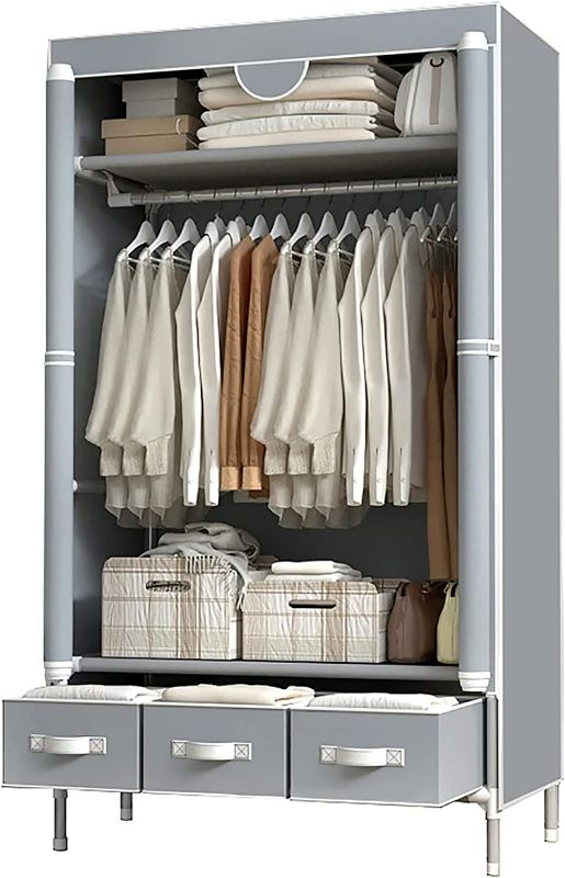 Photo 1 of Portable Clothes Closet Rolling Door Wardrobe with Hanging Rack Non-Woven Fabric Storage Organizer with Three Drawer Boxes No-Tool Assembly - 35.4 x 17.7 x 67.0 ‘’ (Gray)