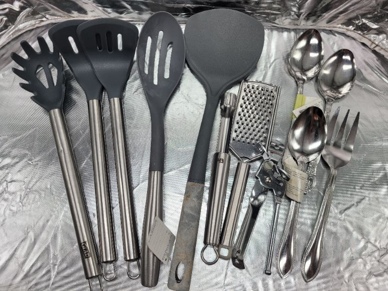 Photo 1 of Assorted Kitchenware Lot - Cooking Utensils, Apple Corer, Grater, Can Opener, Serving Spoons/Fork 