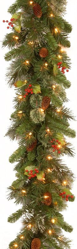 Photo 2 of National Tree Company Pre-Lit Artificial Christmas Garland, Green, Wintry Pine, White Lights, Decorated with Pine Cones, Berry Clusters, Plug In, Christmas Collection, 9 Feet