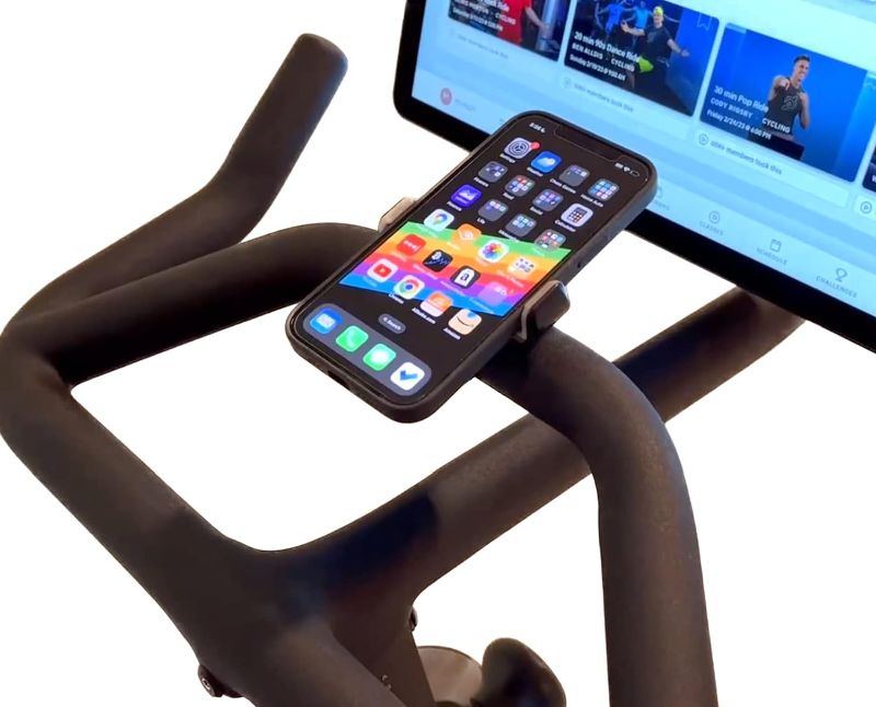 Photo 1 of Phone Holder Compatible with Peloton Bike & Bike Plus - Secure Fit and Easy One-Hand Operation - 360 Degree Rotation - Mount for Stationary Exercise Bikes - Compatible with iPhone & Android Phones.
