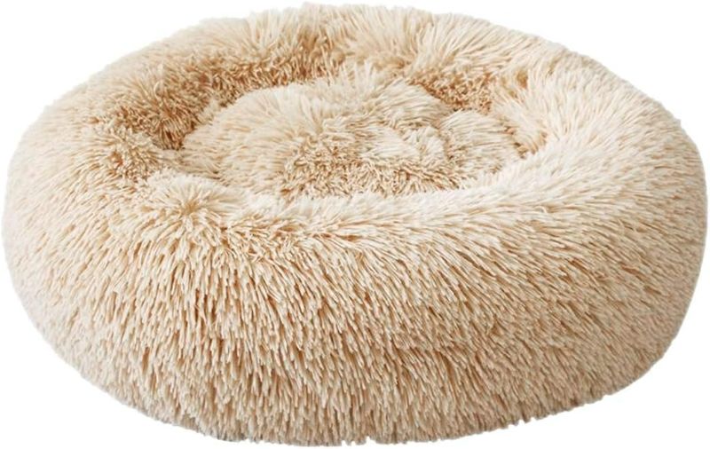 Photo 1 of Round Pet Bed, Plush Soft Washable Self-Warming Calming Dog Bed Donut Cuddler Round Dog Bed Comfortable for Sleeping Winter(Beige)
