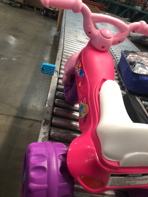 Photo 3 of Fisher-Price Barbie Tough Trike, Toddler Ride-On Toy Tricycle With Storage Compartment
