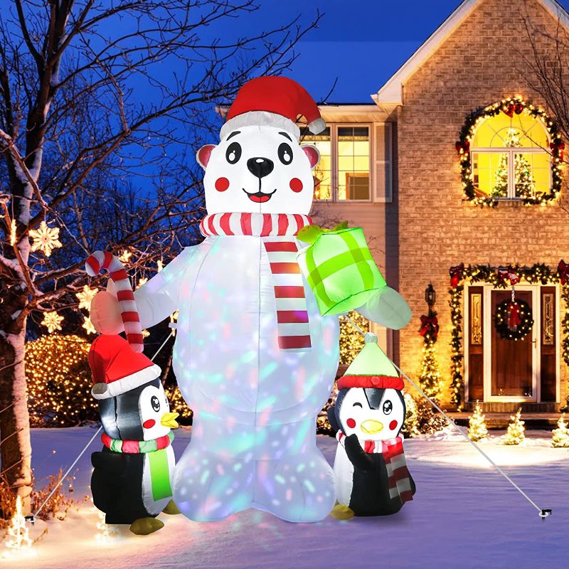 Photo 1 of 2 PENGUINS WITH CANDY CANE AND A BEAR IN THE MIDDLE INFLATABLE DECOR