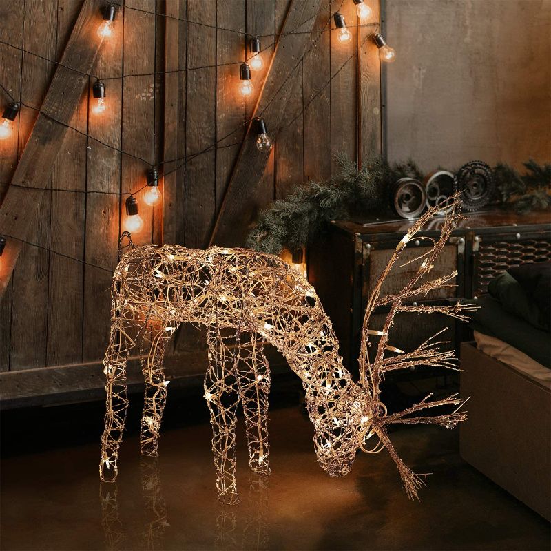 Photo 1 of Alpine Corporation Outdoor/Indoor Rattan Grazing Reindeer with Lights - Christmas and Holiday Decoration for Yard - 24-Inches
