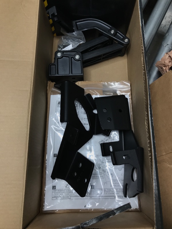 Photo 2 of AMP Research 75313-01A BedStep Flip Down Bumper Step for 17-21 Ford F-250/350/450 (F450 will not work with the vibration dampner installed) , Black
