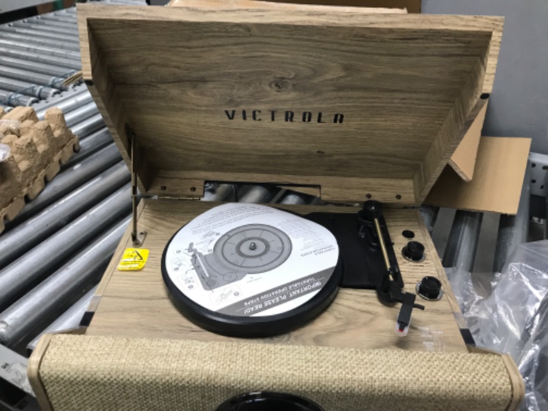 Photo 2 of TURNS ON*
Victrola's 4-in-1 Highland Bluetooth Record Player with 3-Speed Turntable with FM Radio (VTA-330B-FOT)