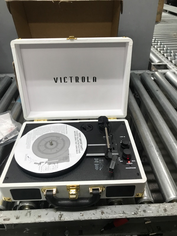 Photo 4 of TURNS ON**
Victrola Vintage 3-Speed Bluetooth Portable Suitcase Record Player with Built-in Speakers | Upgraded Turntable Audio Sound| White (VSC-550BT-WH) White Record Player