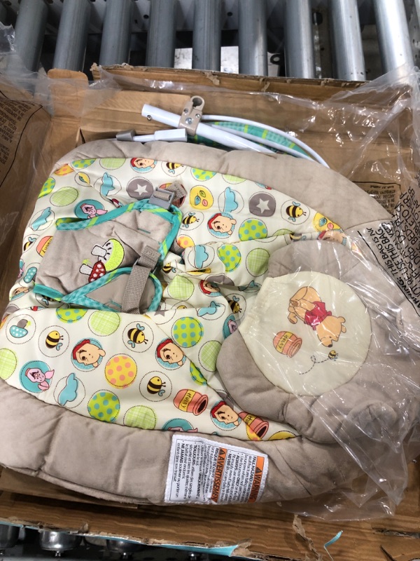 Photo 1 of Bright Starts Winnie the Pooh Dots & Hunny Pots Baby Bouncer with Vibrating Infant Seat, Music & 3 Playtime Toys, 23x19x23 Inch
