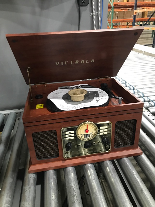 Photo 3 of Power Turns on*
Victrola Nostalgic 6-in-1 Bluetooth Record Player & Multimedia Center with Built-in Speakers - 3-Speed Turntable, CD & Cassette Player, FM Radio | Wireless Music Streaming | Mahogany Mahogany Entertainment Center