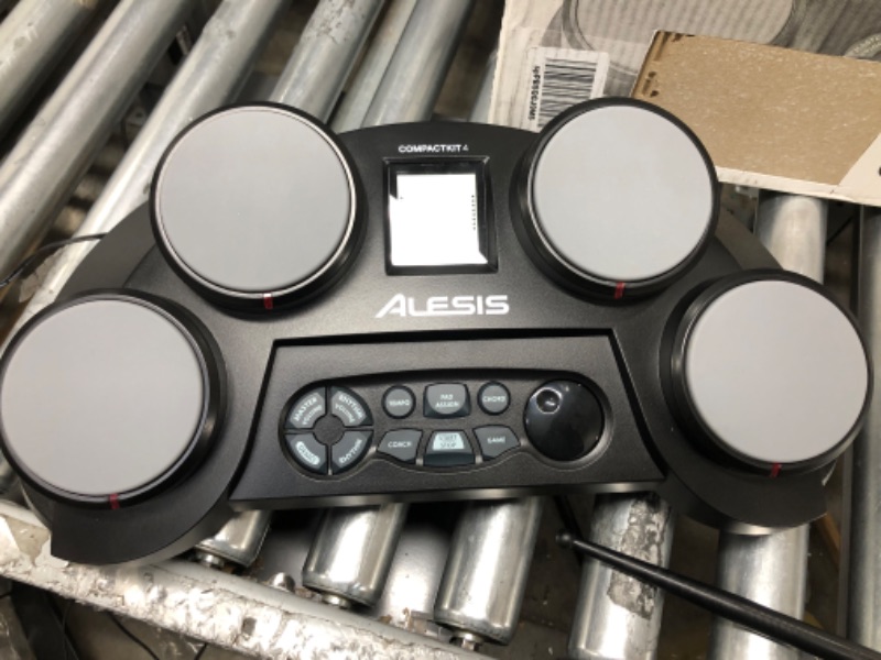 Photo 3 of Alesis Compact Kit 4 – Tabletop Electric Drum Set with 70 Electronic / Acoustic Drum Kit Sounds, 4 Pads, Battery- or Ac-power and Drum Sticks Included