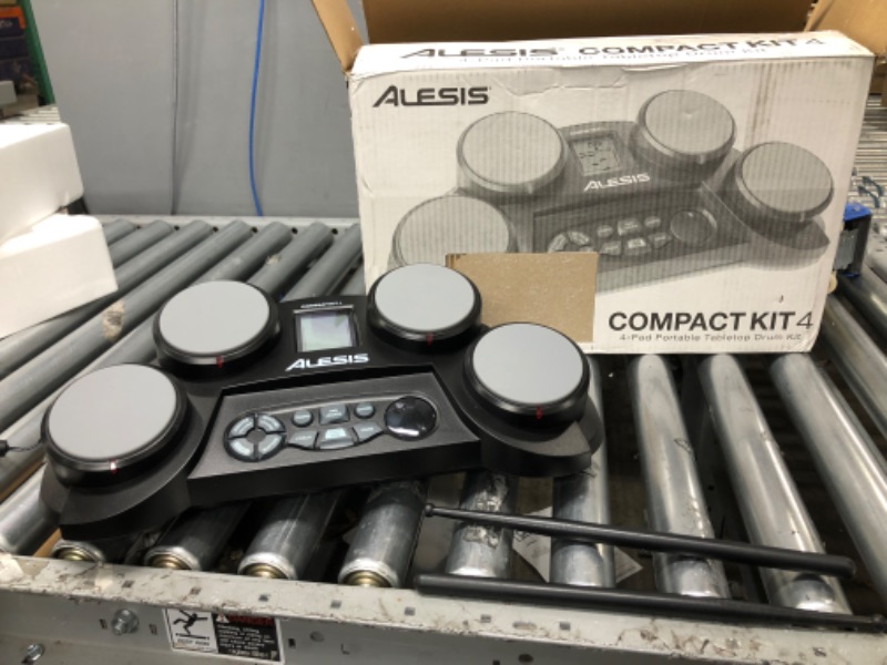 Photo 5 of Alesis Compact Kit 4 – Tabletop Electric Drum Set with 70 Electronic / Acoustic Drum Kit Sounds, 4 Pads, Battery- or Ac-power and Drum Sticks Included