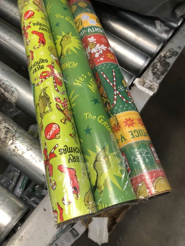 Photo 2 of American Greetings Christmas Wrapping Paper with Cut Lines Bundle, The Grinch (3 Rolls, 105 sq. ft.)