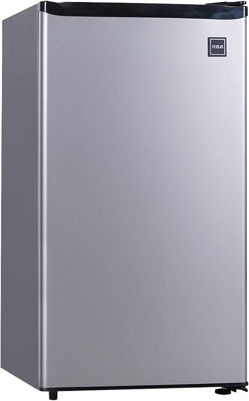 Photo 1 of **DIRTY FROM USE ***RCA RFR322 Mini Refrigerator, Compact Freezer Compartment, Adjustable Thermostat Control, Reversible Door, Ideal Fridge for Dorm, Office, Apartment, Platinum Stainless, 3.2 Cubic Feet
