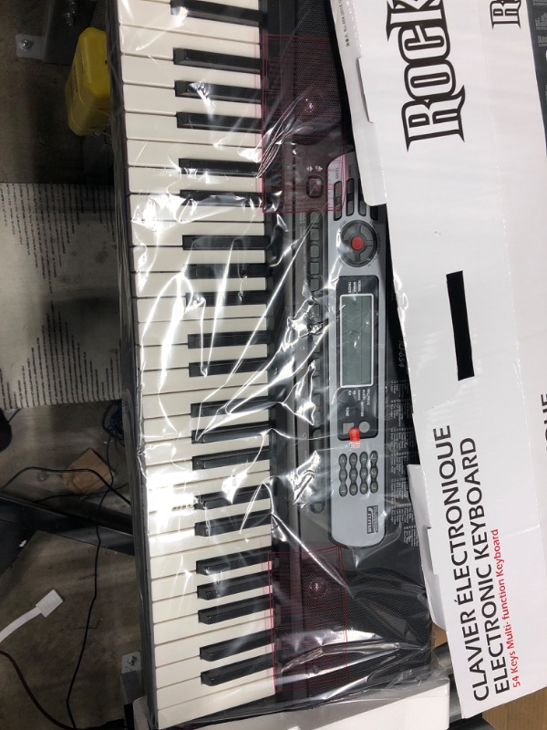 Photo 2 of RockJam 54-Key Portable Electronic Keyboard with Interactive LCD Screen & Includes Piano Maestro Teaching App with 30 Songs & Adjustable Keyboard Stand with Locking Straps & Quick Release Mechanism