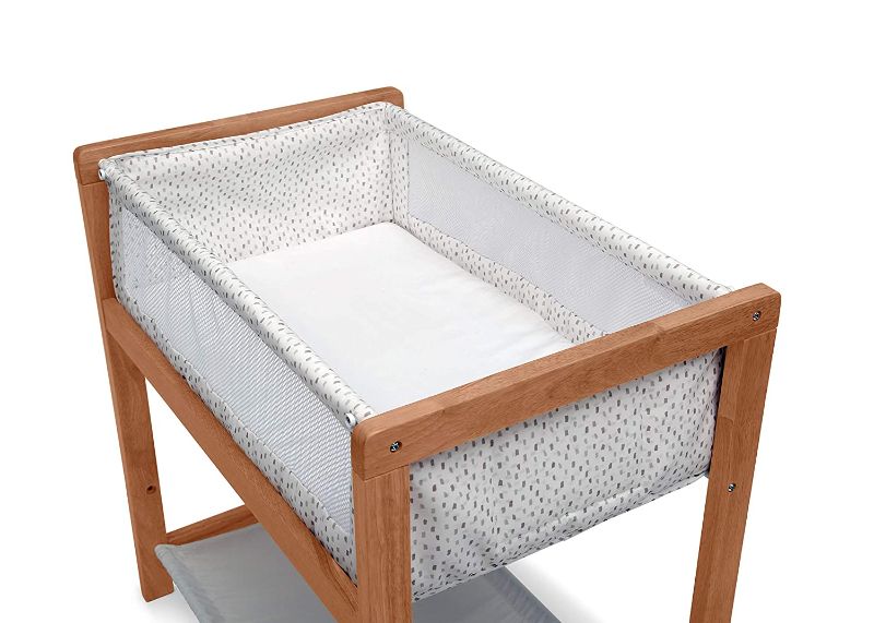 Photo 1 of Delta Children Classic Wood Bedside Bassinet Sleeper Portable Crib with HighEnd Wood Frame, Paint Dabs