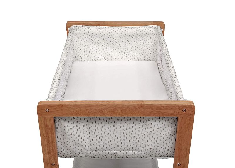 Photo 1 of Delta Children Classic Wood Bedside Bassinet Sleeper Portable Crib with HighEnd Wood Frame, Paint Dabs