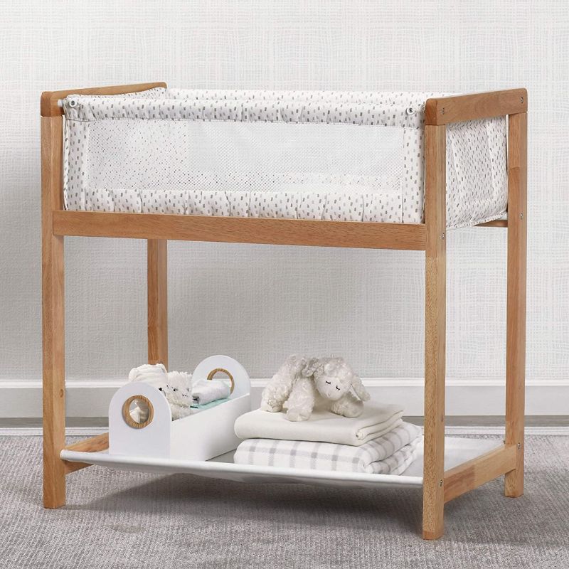 Photo 1 of Delta Children Classic Wood Bedside Bassinet Sleeper Portable Crib with HighEnd Wood Frame, Paint Dabs