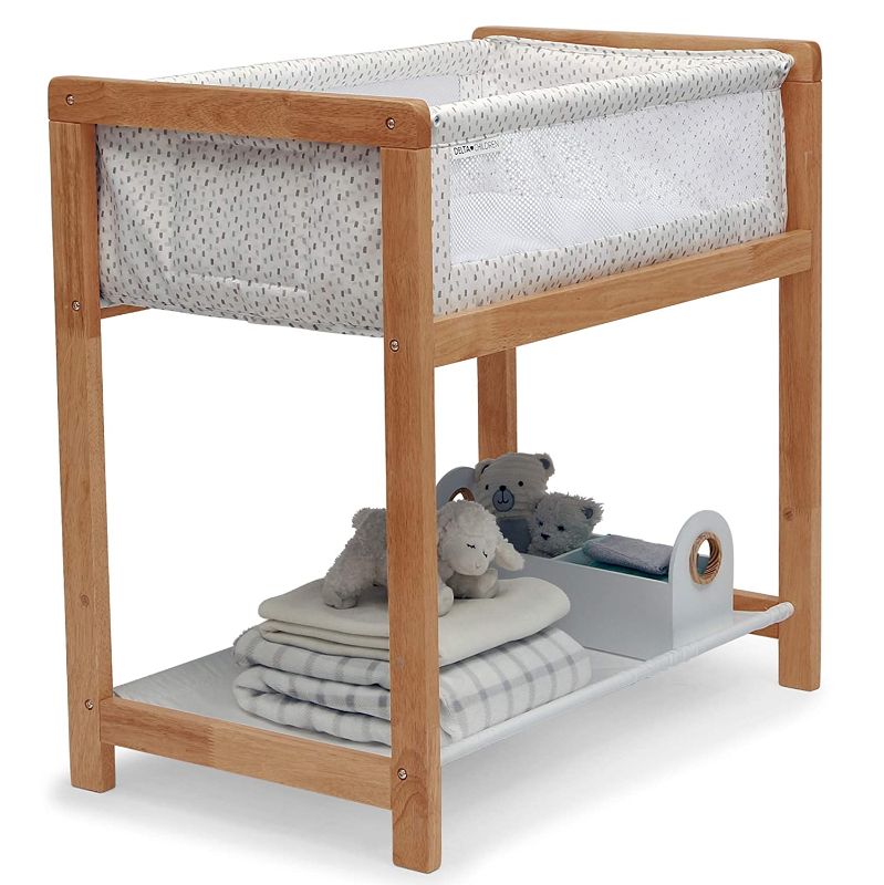 Photo 1 of Delta Children Classic Wood Bedside Bassinet Sleeper Portable Crib with HighEnd Wood Frame, Paint Dabs