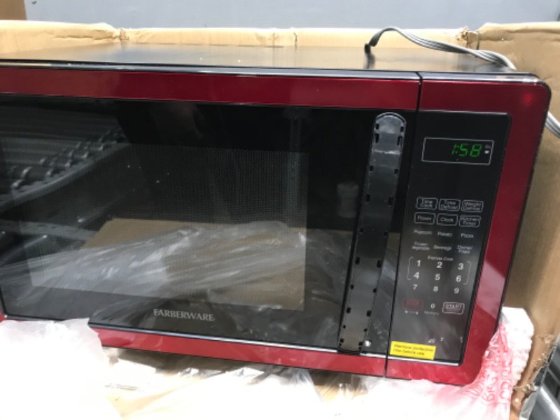 Photo 2 of *HANDLE SLIGHTLY BROKEN* Farberware Classic FMO11AHTBKN 1.1 Cu. Ft. 1000-Watt Microwave Oven with LED Lighting, Metallic Red