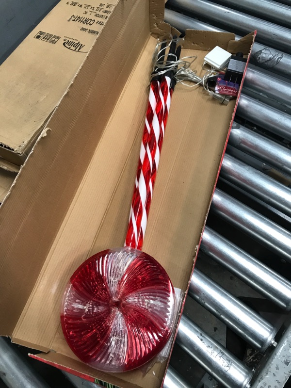 Photo 2 of Alpine Corporation 28" H Outdoor Candy Cane Yard Stakes with Red and White LED Lights (Set of 3)