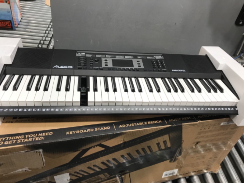Photo 1 of 094318023624Alesis Melody 61 Key Keyboard Piano for Beginners with Speakers, Stand, Bench, Headphones, Microphone, Sheet Music Stand, 300 Sounds and Music Lessons
