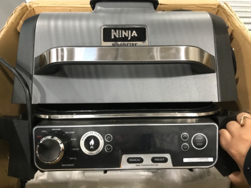 Photo 3 of ***NON FUNCTIONAL****   Ninja OG701 Woodfire Outdoor Grill, 7-in-1 Master Grill, BBQ Smoker, & Outdoor Air Fryer plus Bake, Roast, Dehydrate, & Broil, Woodfire Technology, uses Ninja Woodfire Pellets, Weather-Resistant, Grey
