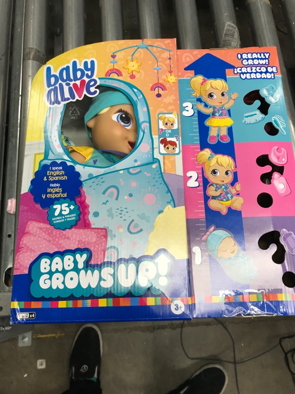 Photo 2 of Baby Alive Baby Grows Up (Happy) - Happy Hope or Merry Meadow, Growing and Talking Baby Doll, Toy with 1 Surprise Doll and 8 Accessories , Blue
