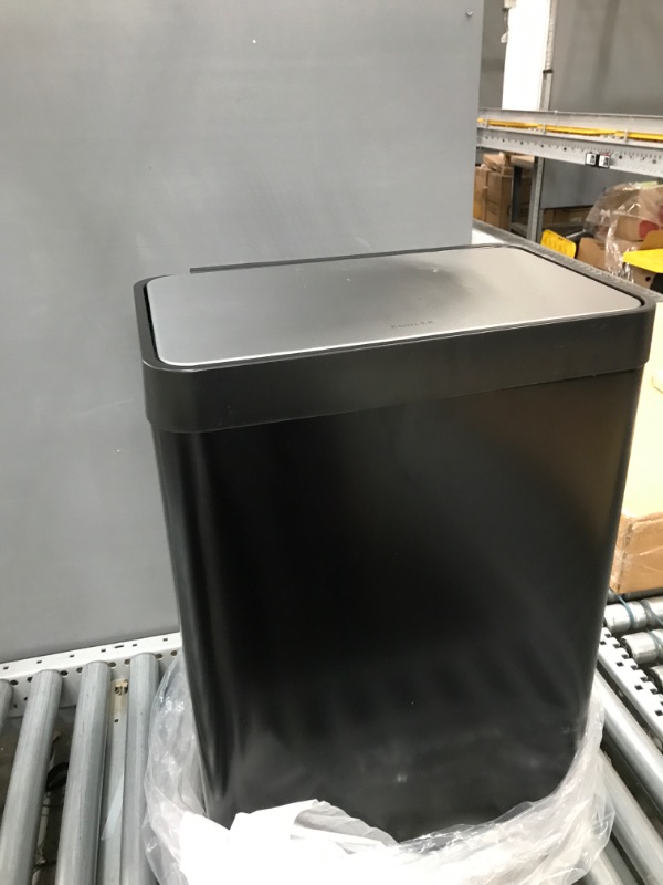Photo 2 of **** USED **** *** SMALL SHIPPING DAMAGE LID IS STILL FUNCTIONAL***
Kohler 20940-BST Step Trash Can, 13 Gallon, Black with Stainless Steel Black Stainless Steel 13 Gallon Can