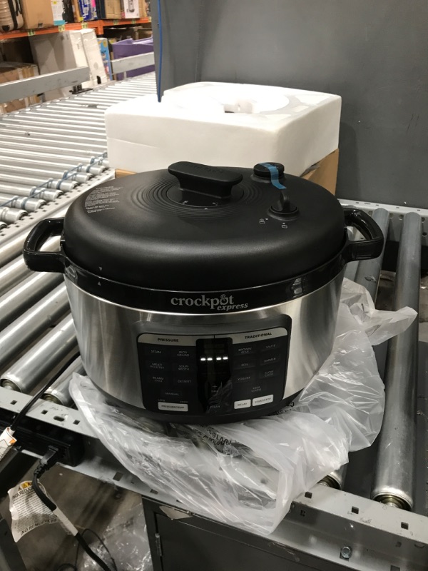 Photo 2 of The Crockpot Express Pressure Cooker 6-Quart Oval Max is designed to make it even easier to prepare home-cooked meals in record time. The oval design easily ?ts large cuts of meat, like a whole rack of ribs, or an entire pork roast, without having to stac